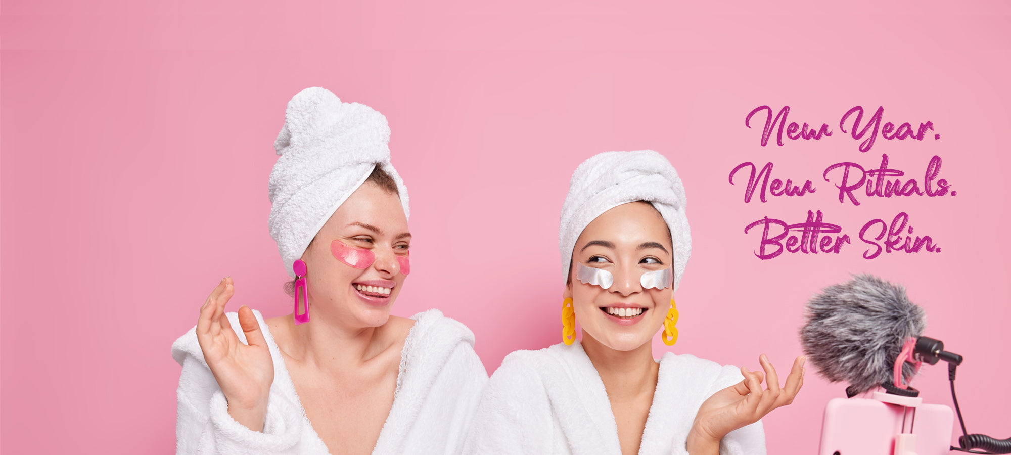 Two women with towels on heads, wearing eye masks, against a pink background with text about skincare routines.
