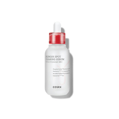 COSRX serum bottle with red cap on a white background